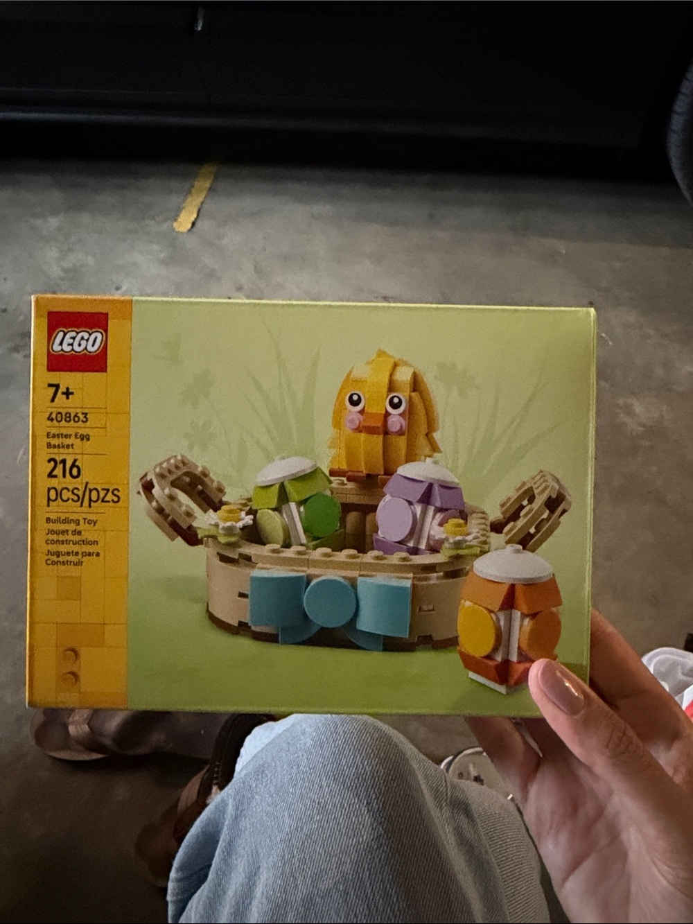 Lego pastel yellow chick with tan basket and multicolor eggs